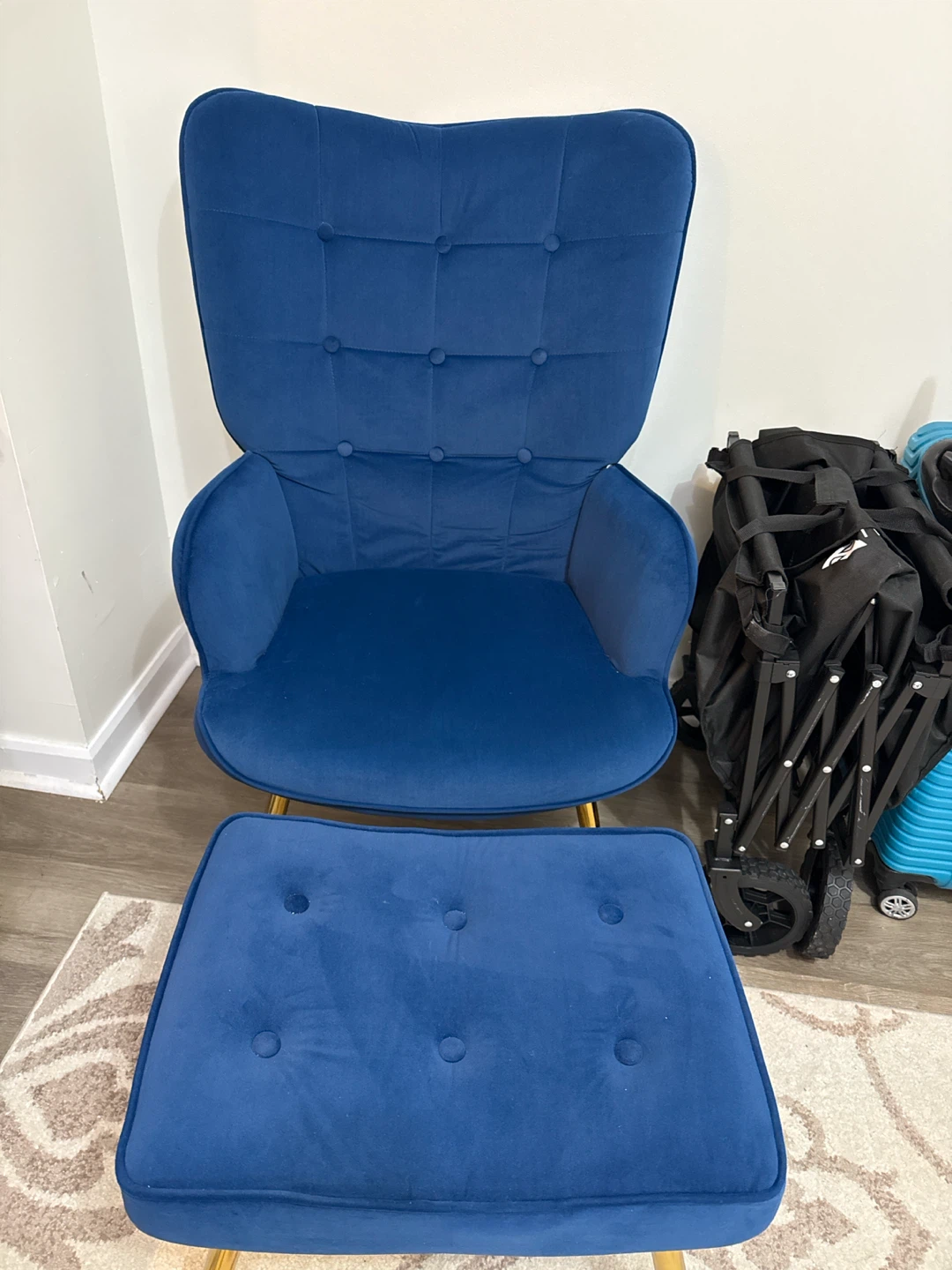 Blue velvet accent chair with ottoman