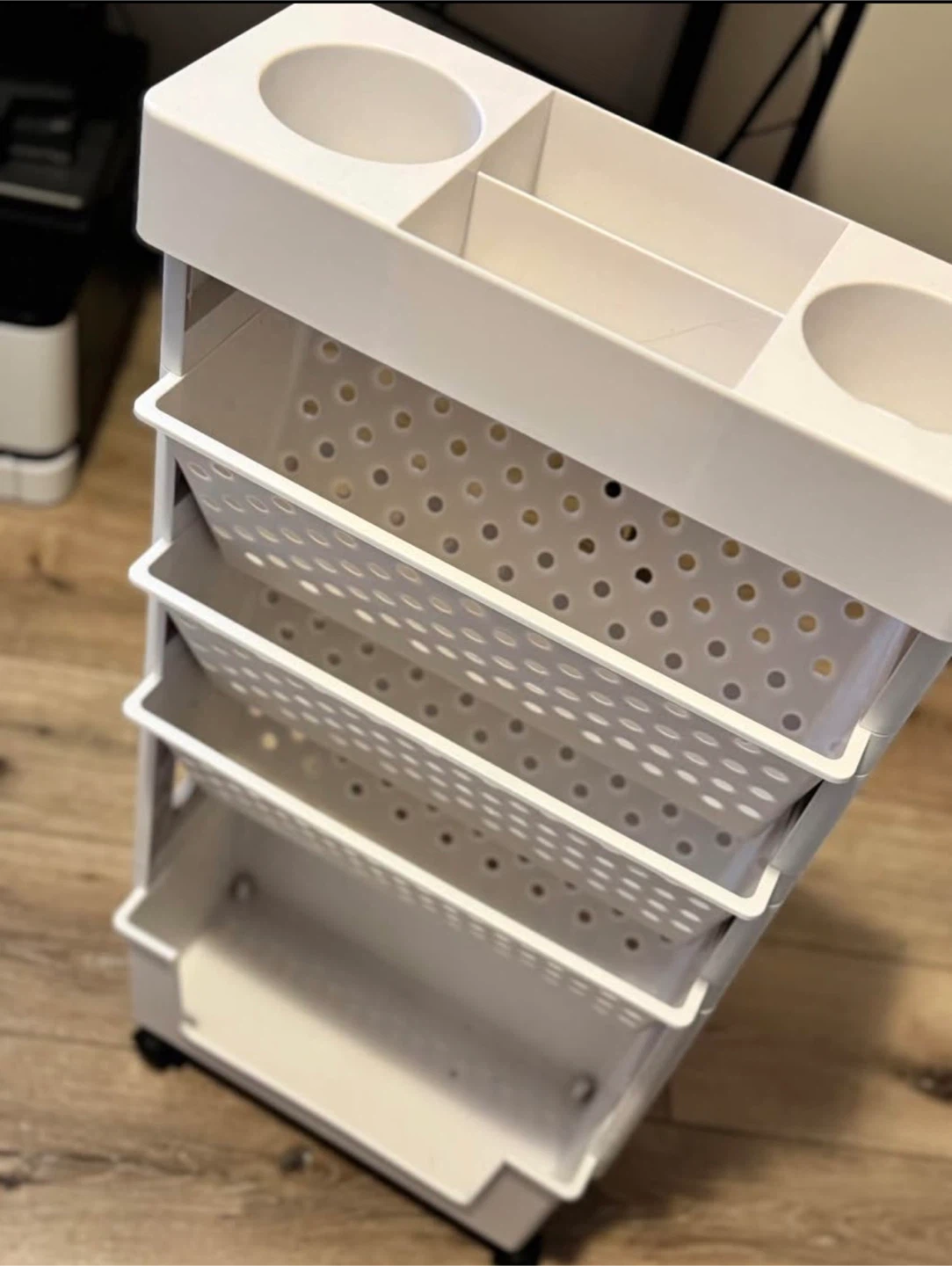 White plastic rolling storage cart