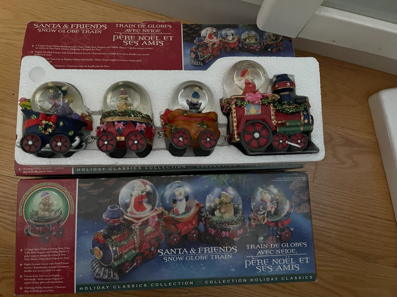 $10 each ， Holiday Classics Santa & Friends Snow Globe Train
