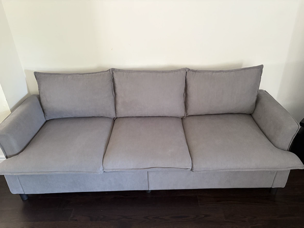 Grey corduroy three-seater sofa