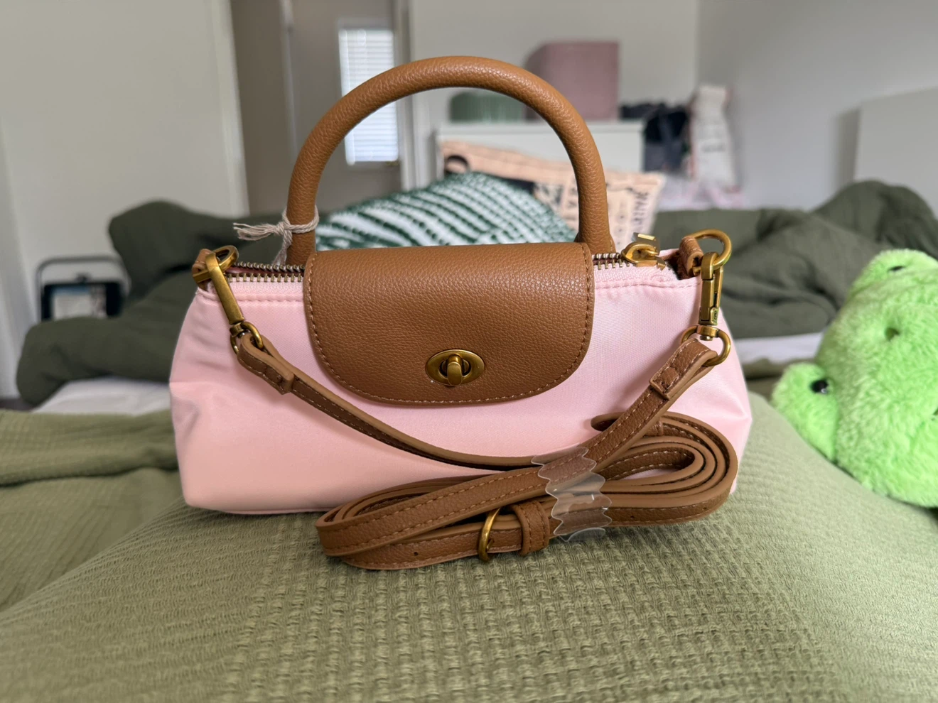Small pink handbag with strap