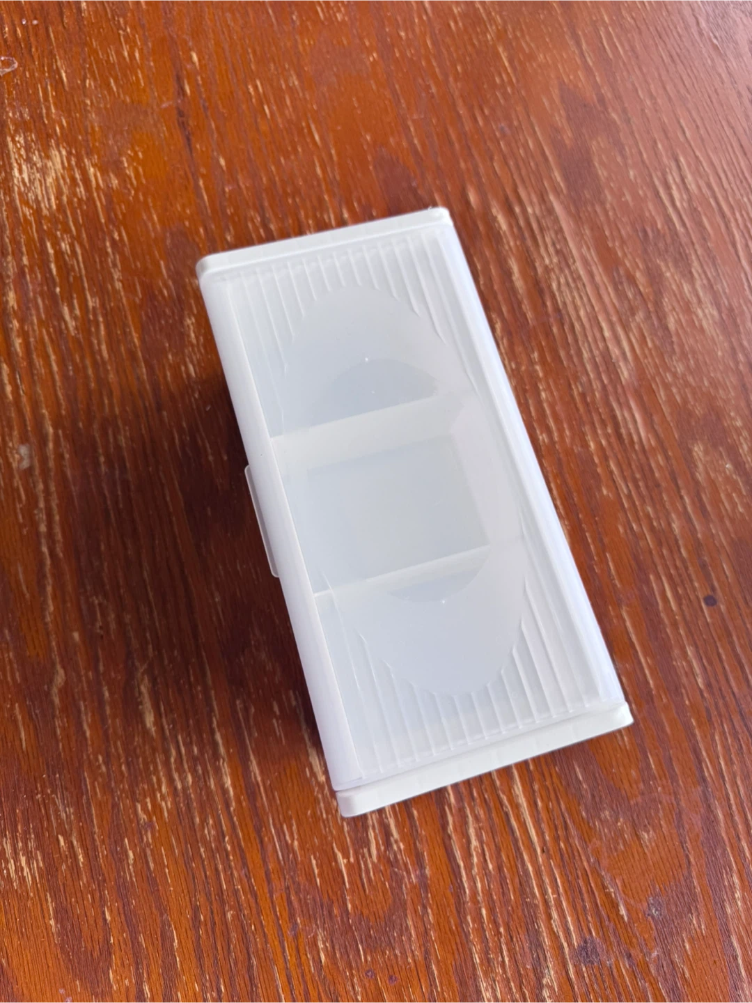 Three-compartment white plastic storage tray