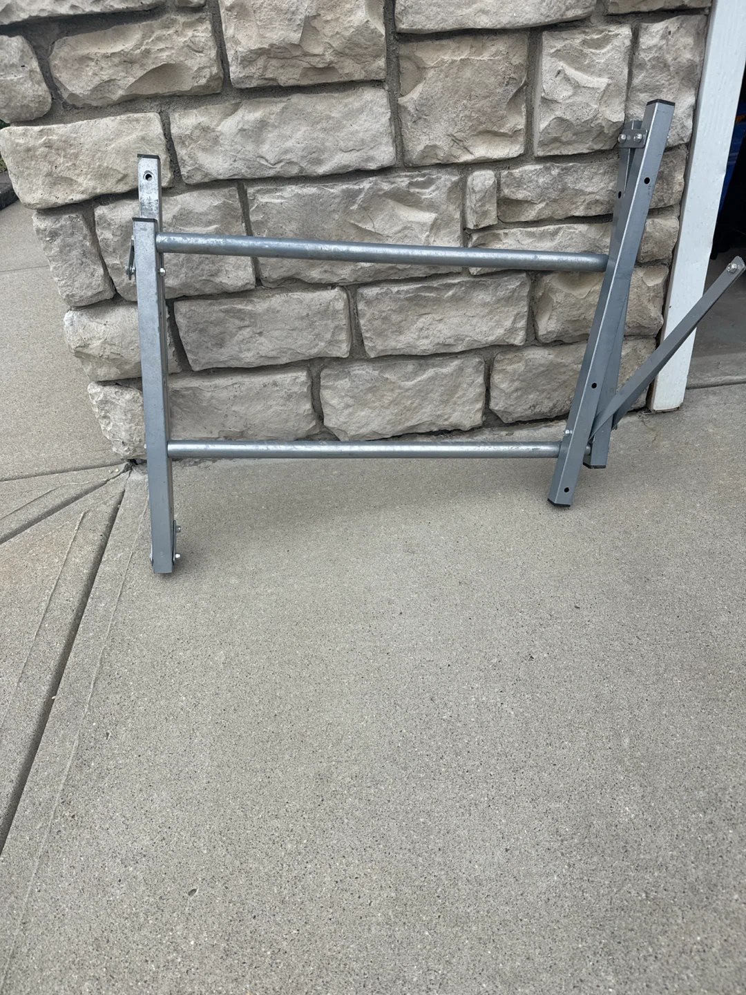Folding tire storage rack