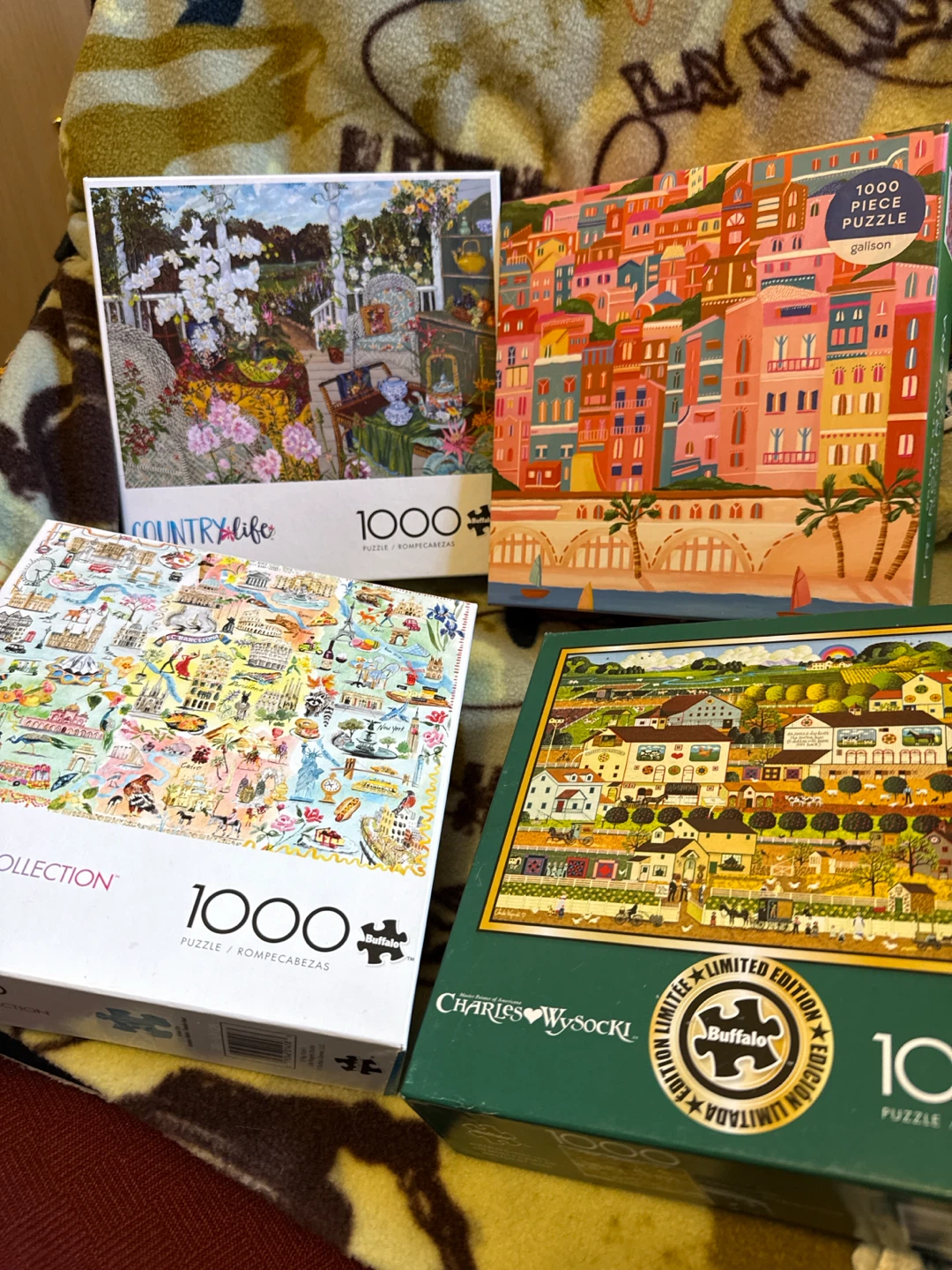 Set of 4 Buffalo and Galison 1000-Piece Puzzles