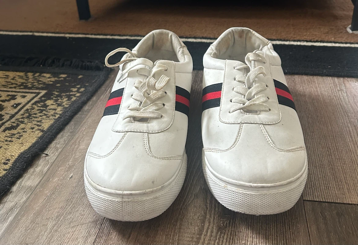 White sneakers with red and navy side stripes