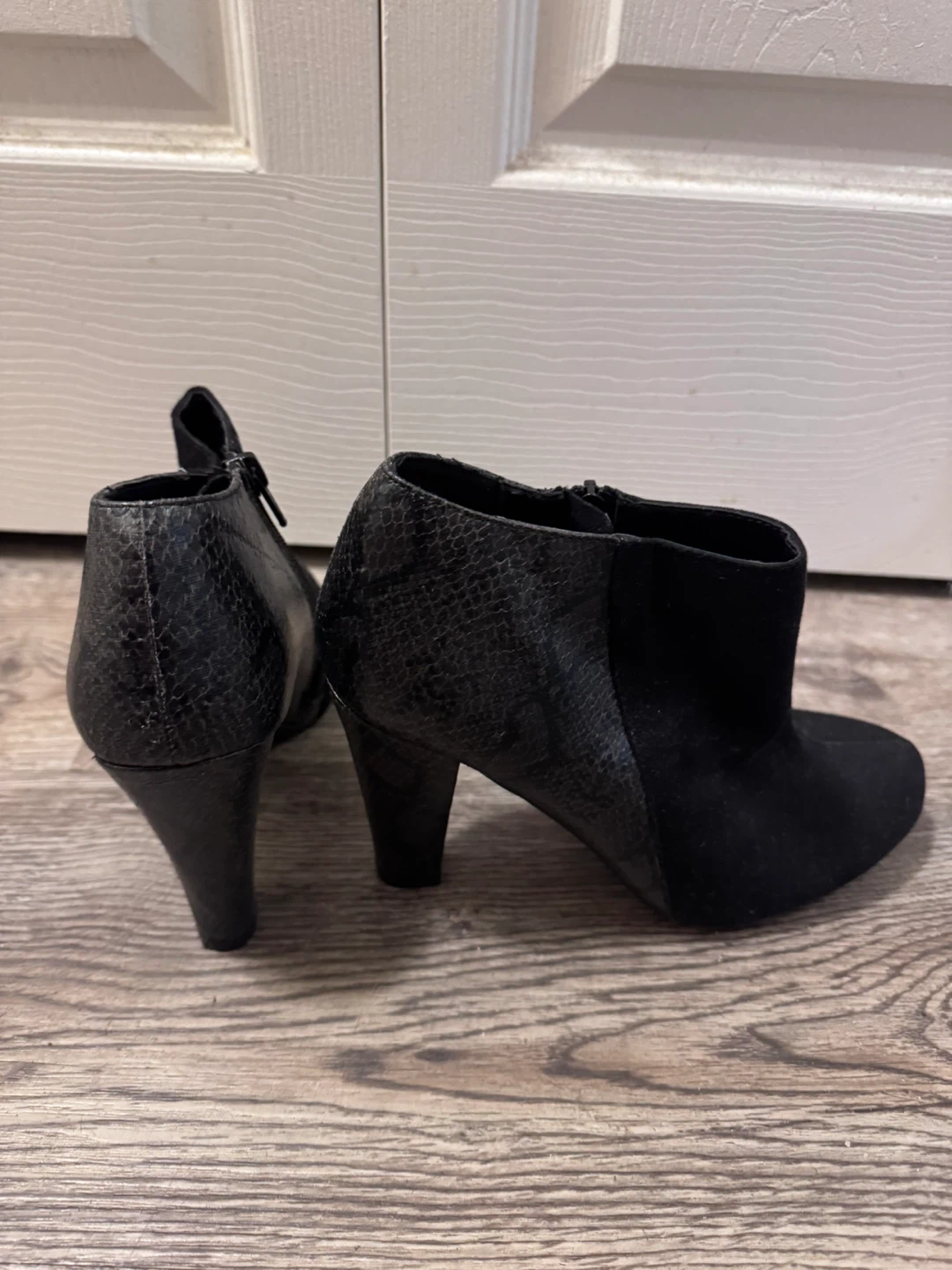 Black ankle boots with snake print detail