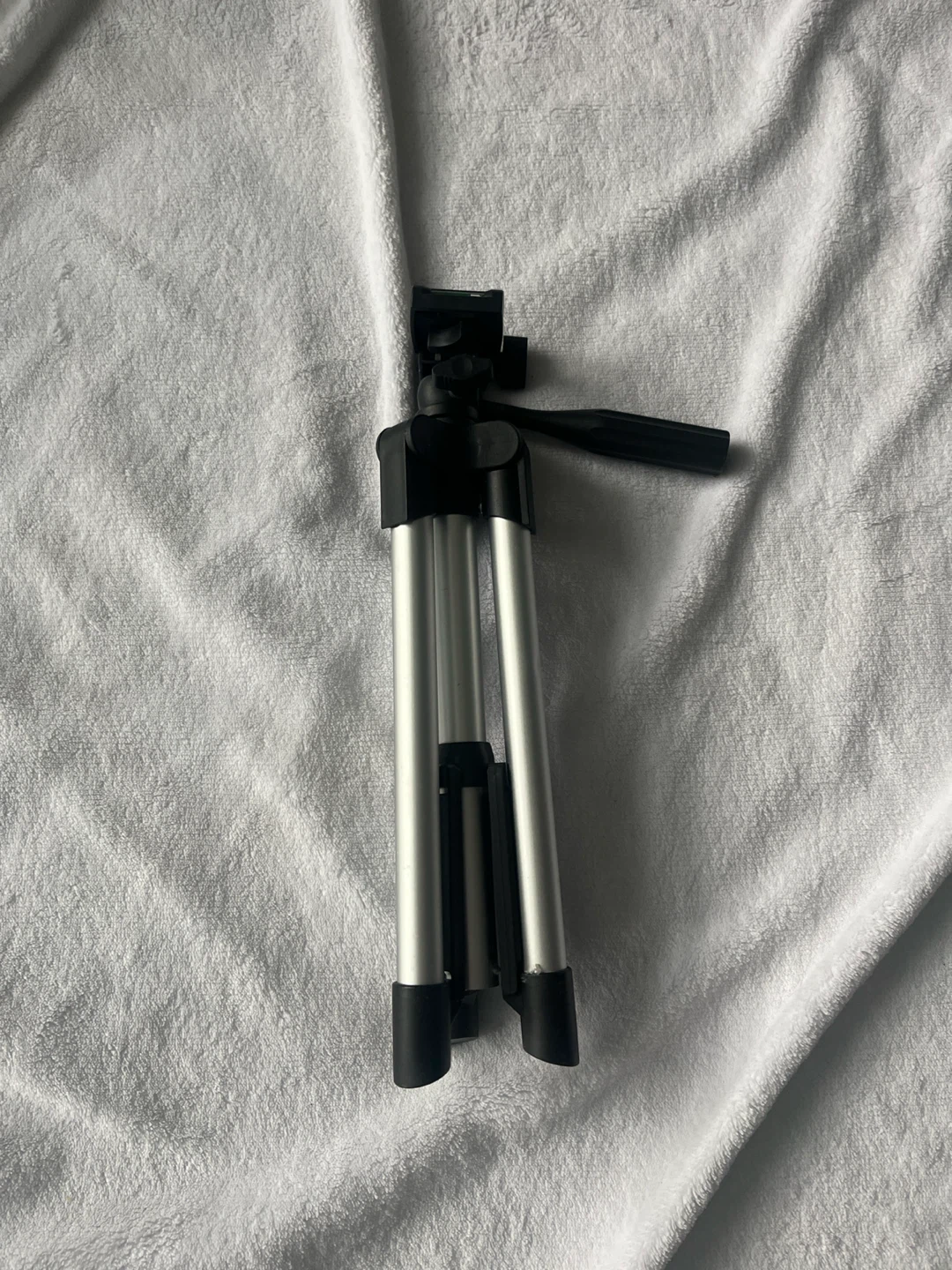 Compact Silver and Black Camera Tripod