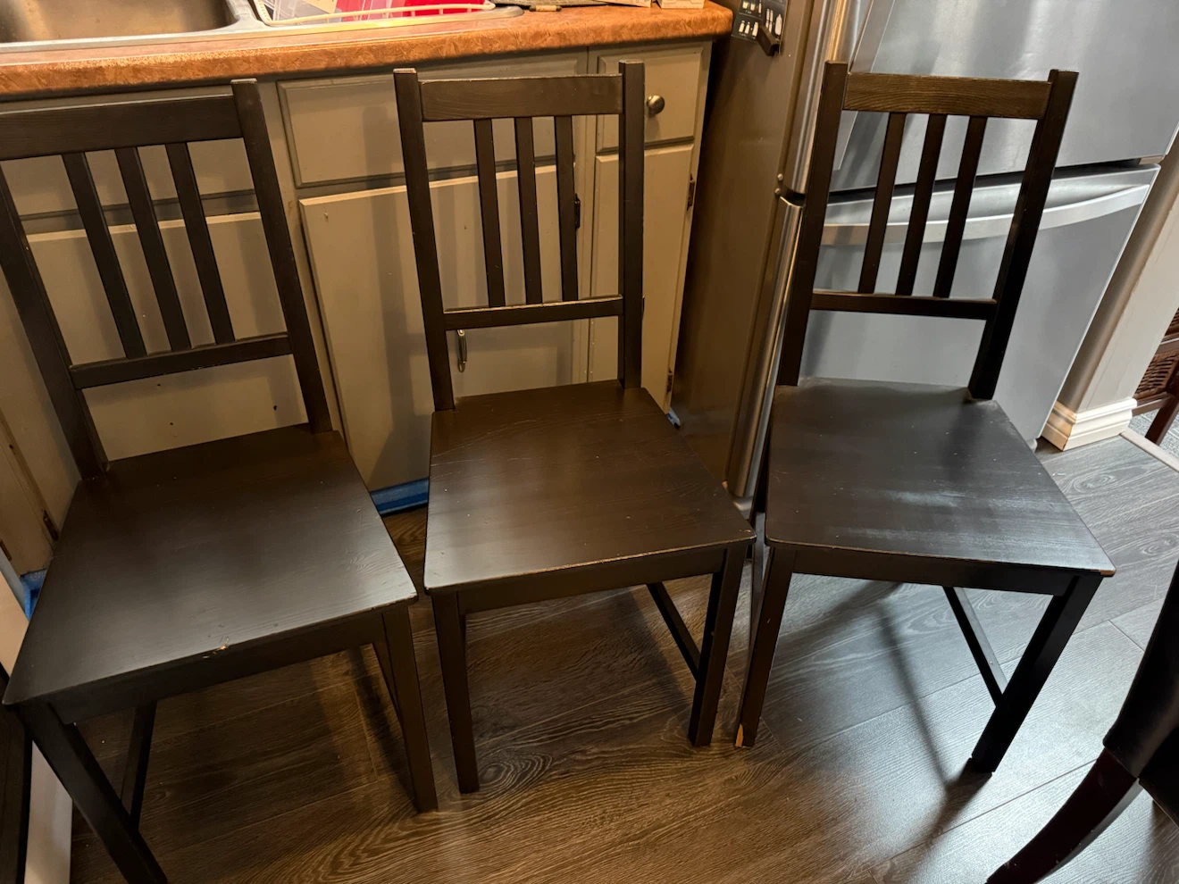 Three dark wood dining chairs - photo 3