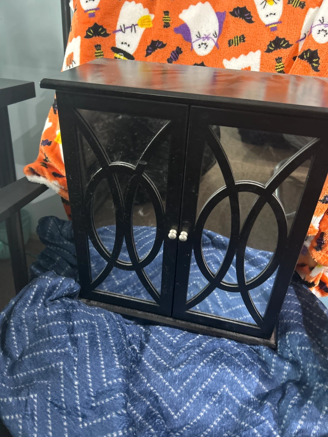 Black wooden jewelry armoire