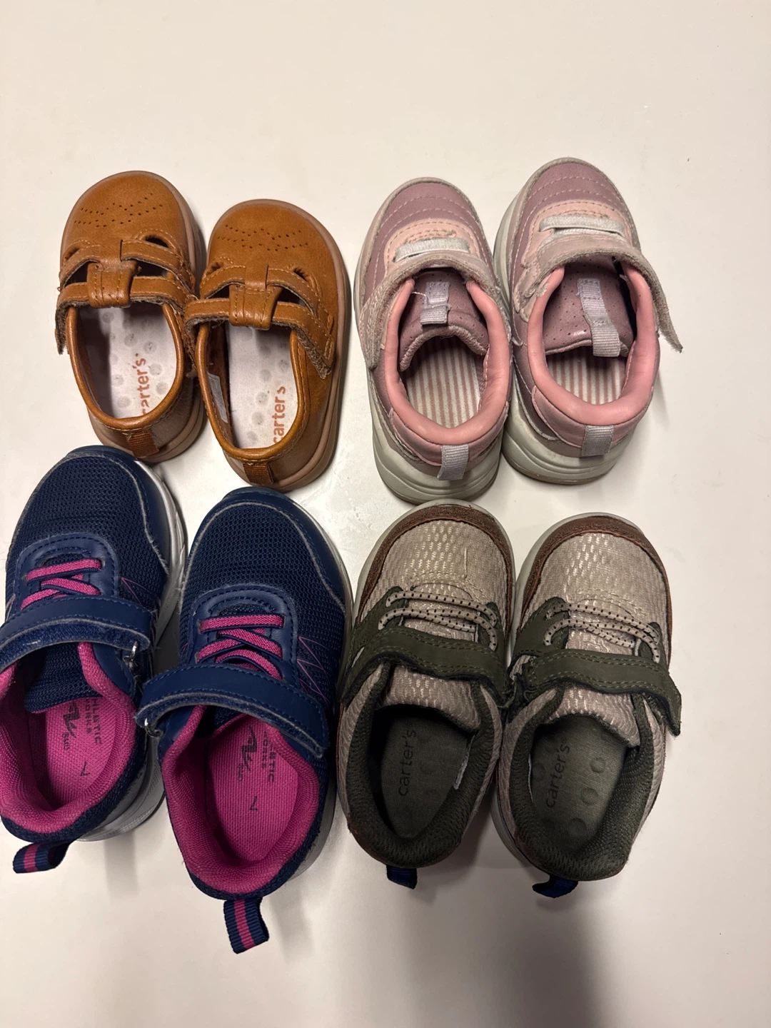 Four pairs of toddler shoes, size 7