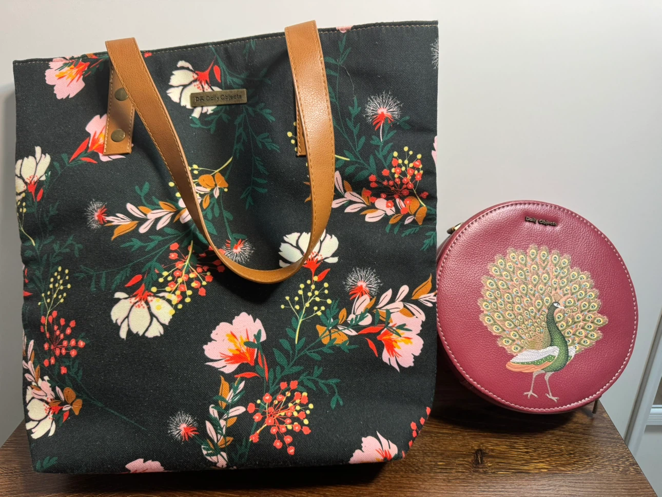 Daily Objects floral tote and round peacock bag