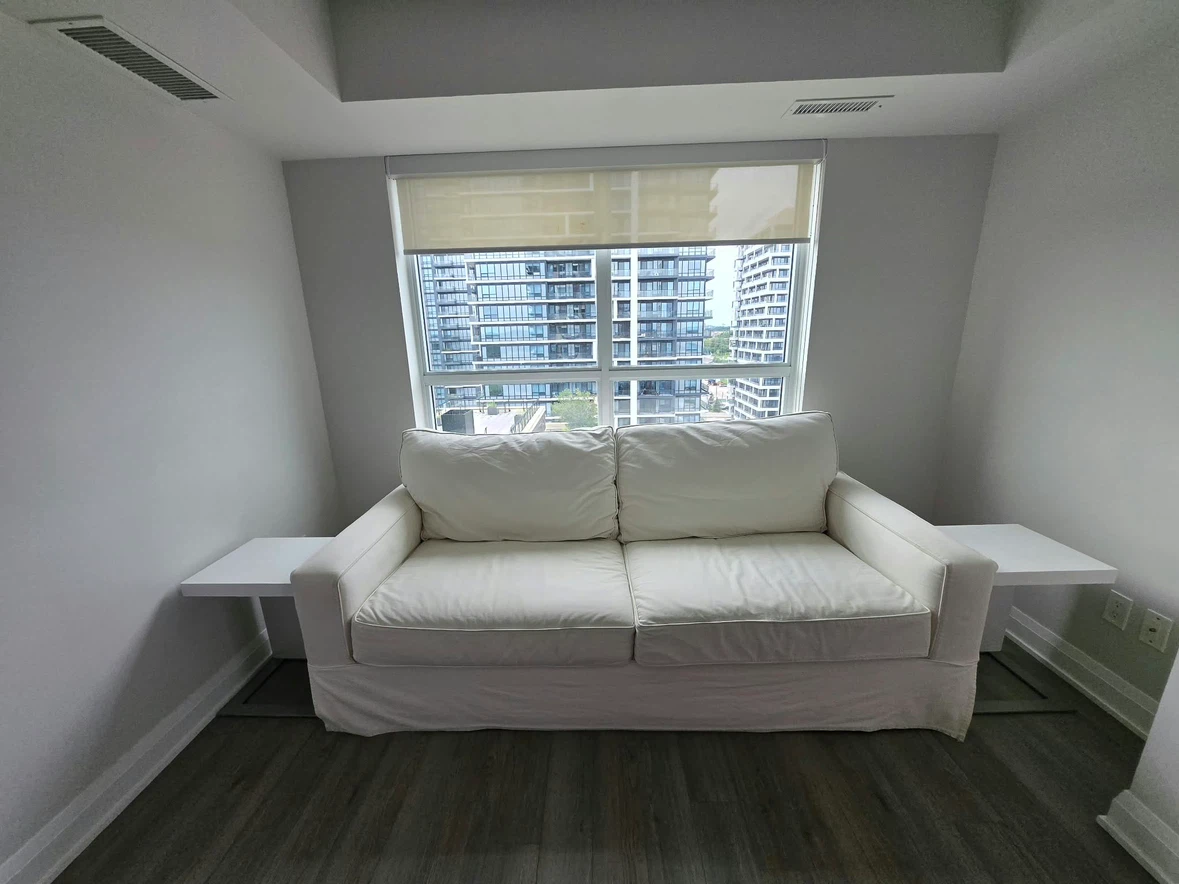 Off-white slipcovered sofa and armchair