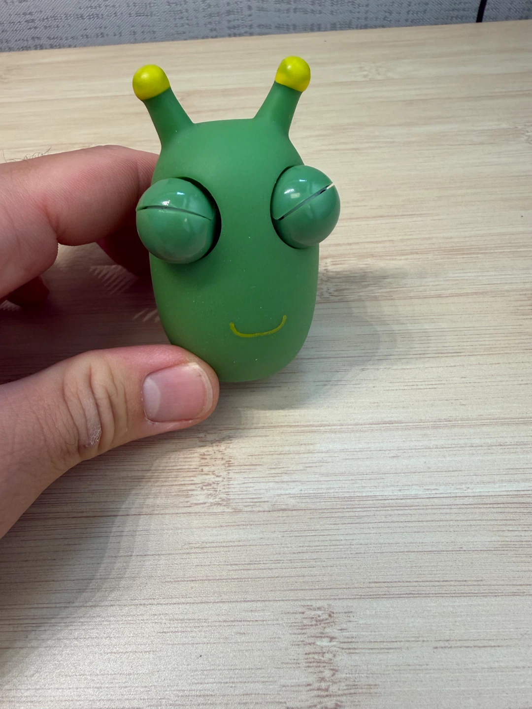 Green alien eye-popping stress toy