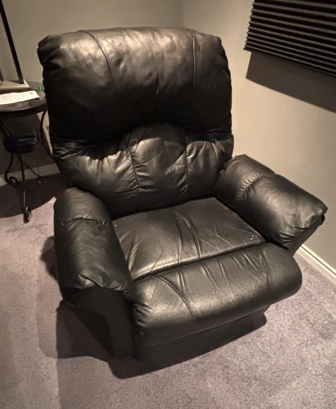 Black leather recliner armchair