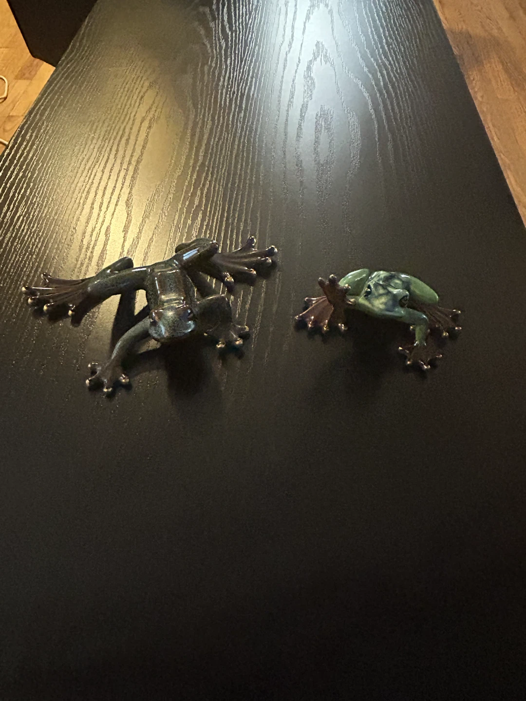 Set of two decorative ceramic frog figures
