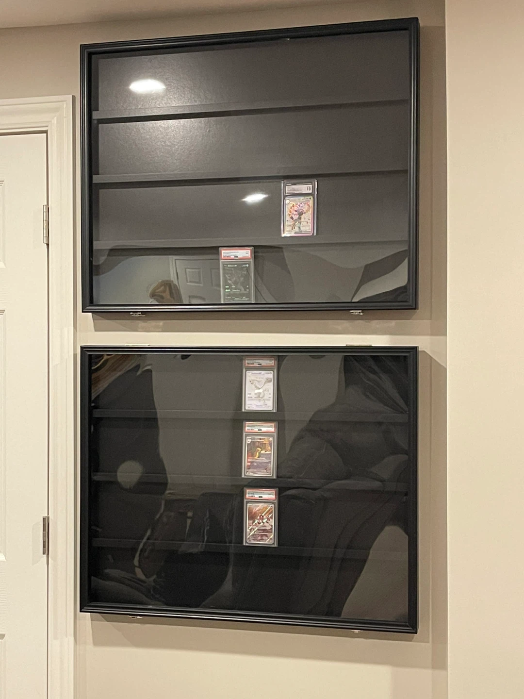 Two Black Wall-Mounted Display Cases