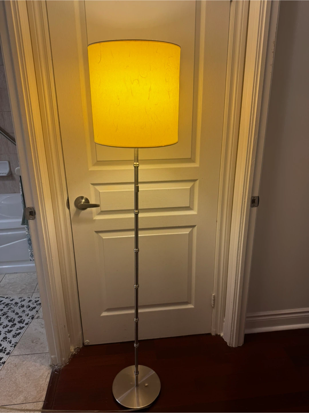Tall floor lamp with yellow textured shade