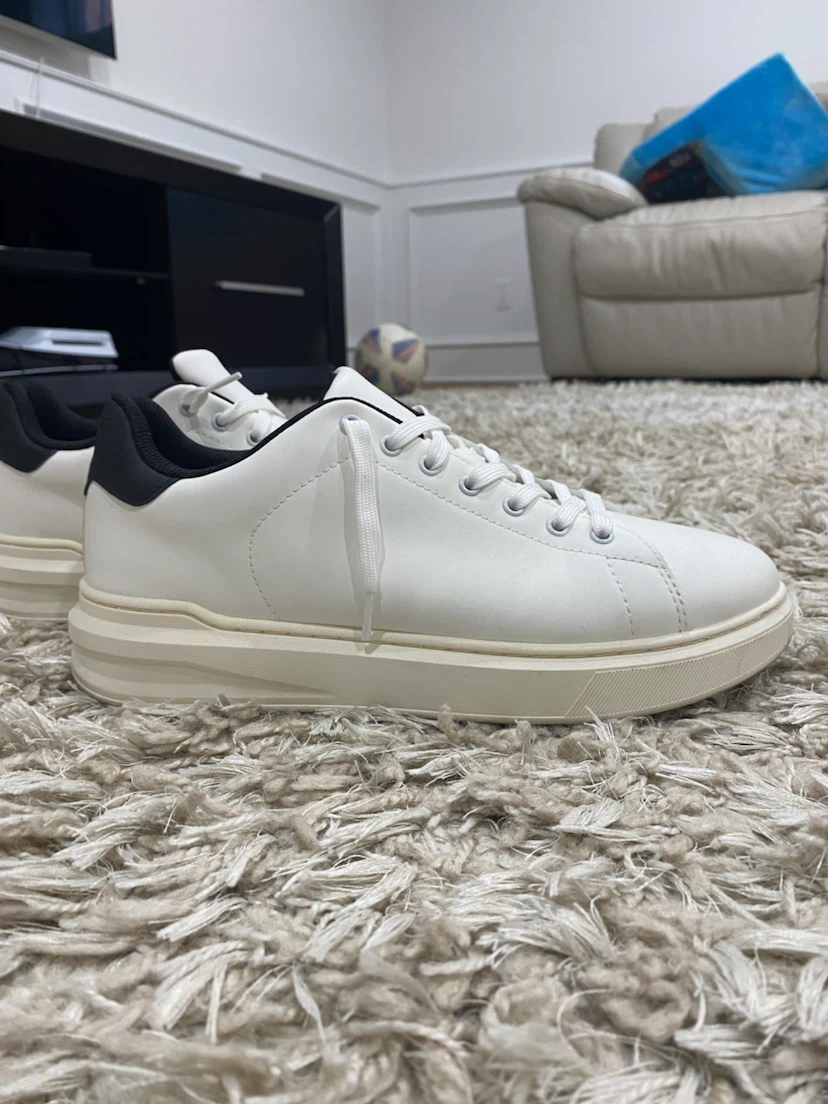 White sneakers with black heel detail
