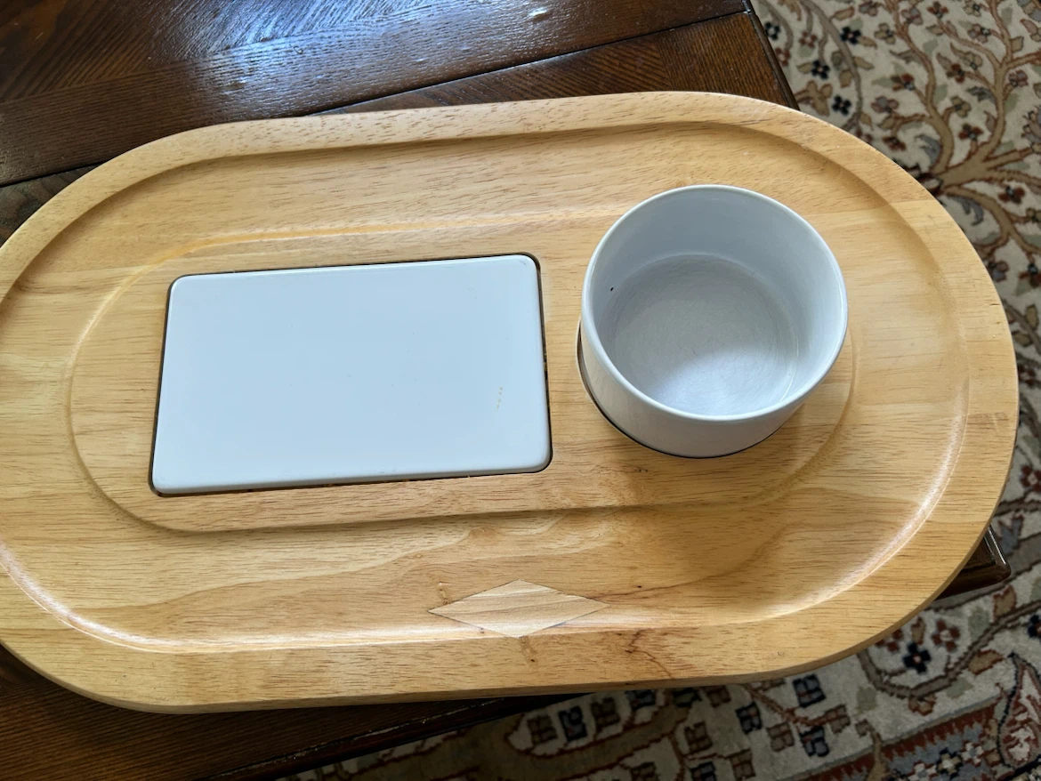 Cheese and crackers serving board with cheese spread knife