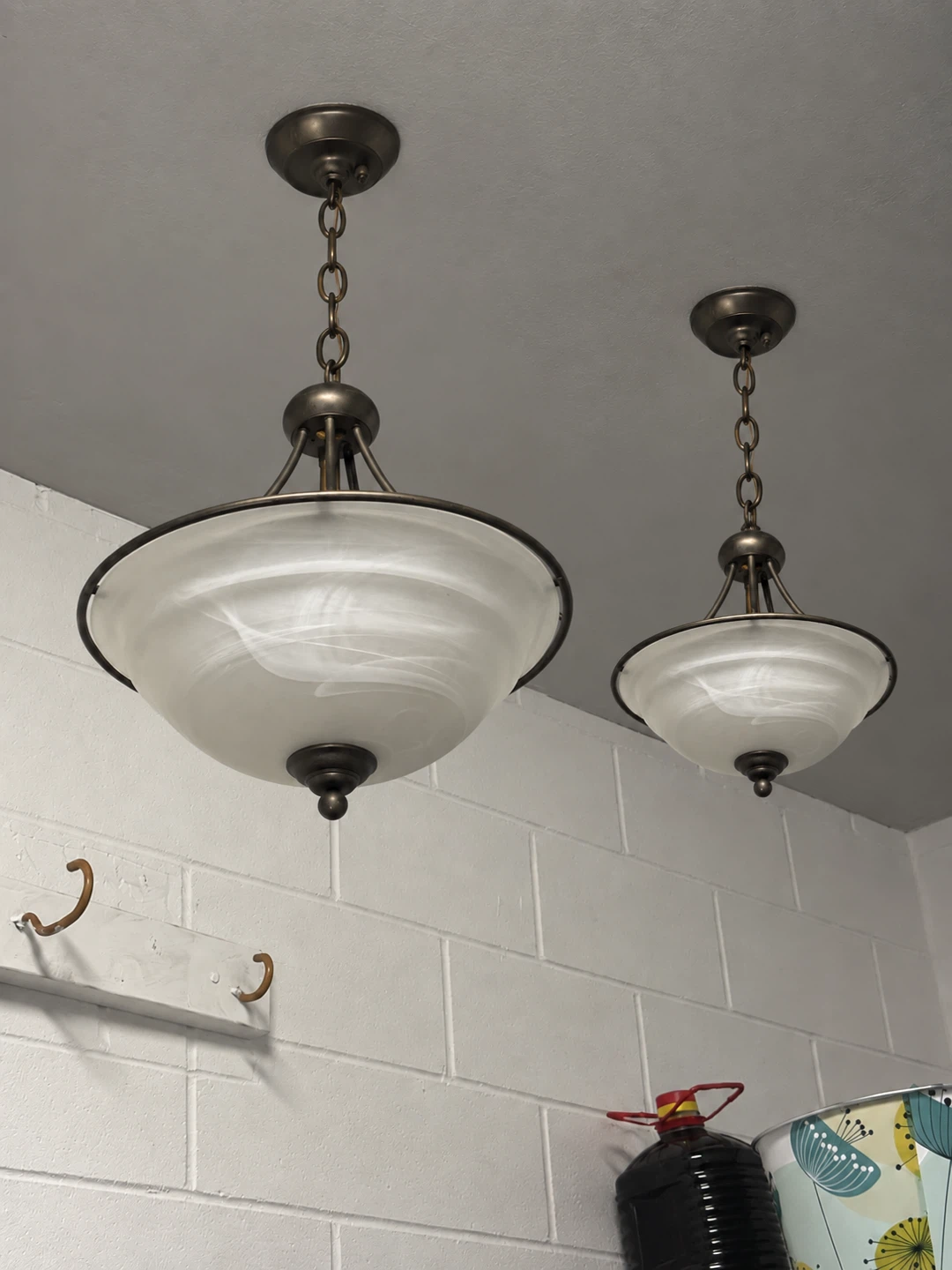 Two Bronze Pendant Lights with Swirled Glass Shades