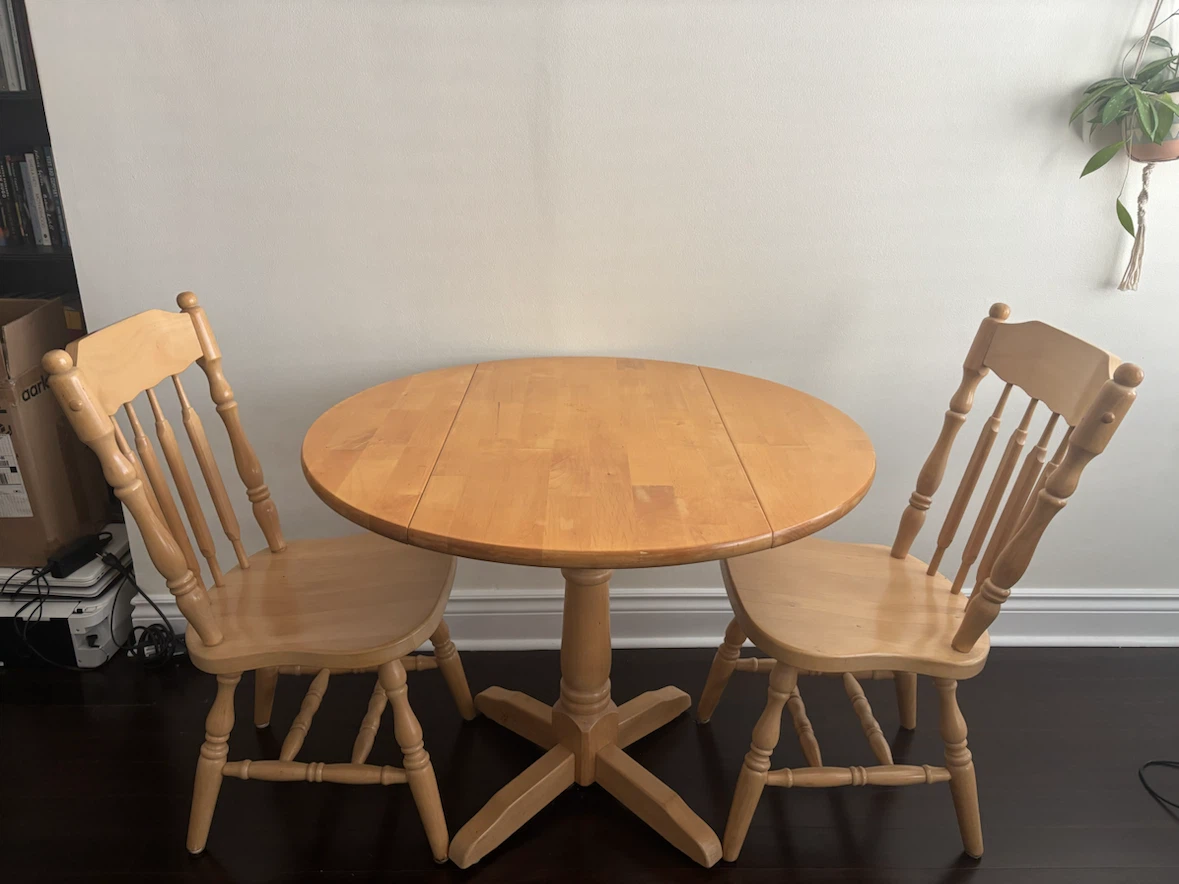 Wood drop-leaf dining table with two chairs