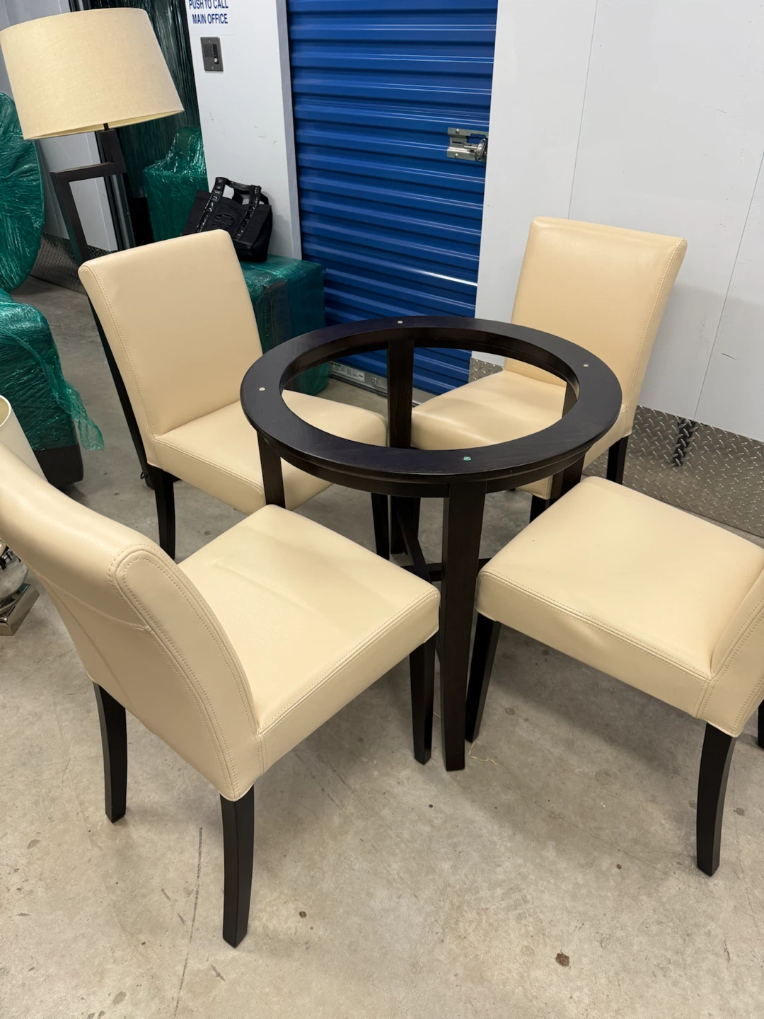 Round Glass Top Table with 4 faux leather chairs
