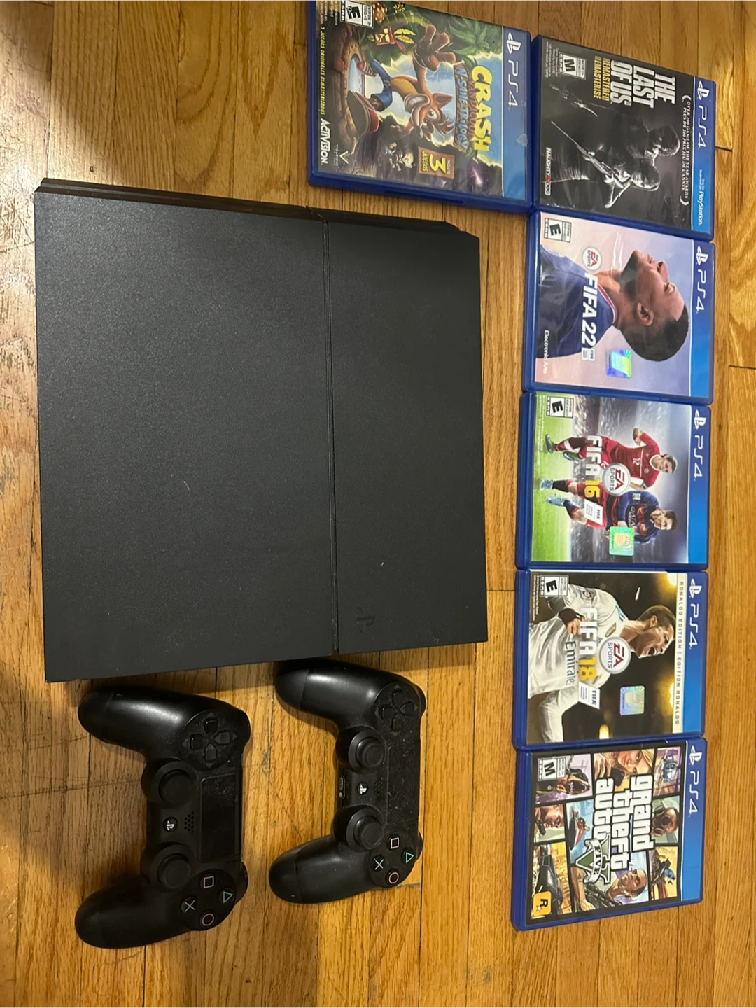 PlayStation 4 Console with 2 Controllers and 5 Games