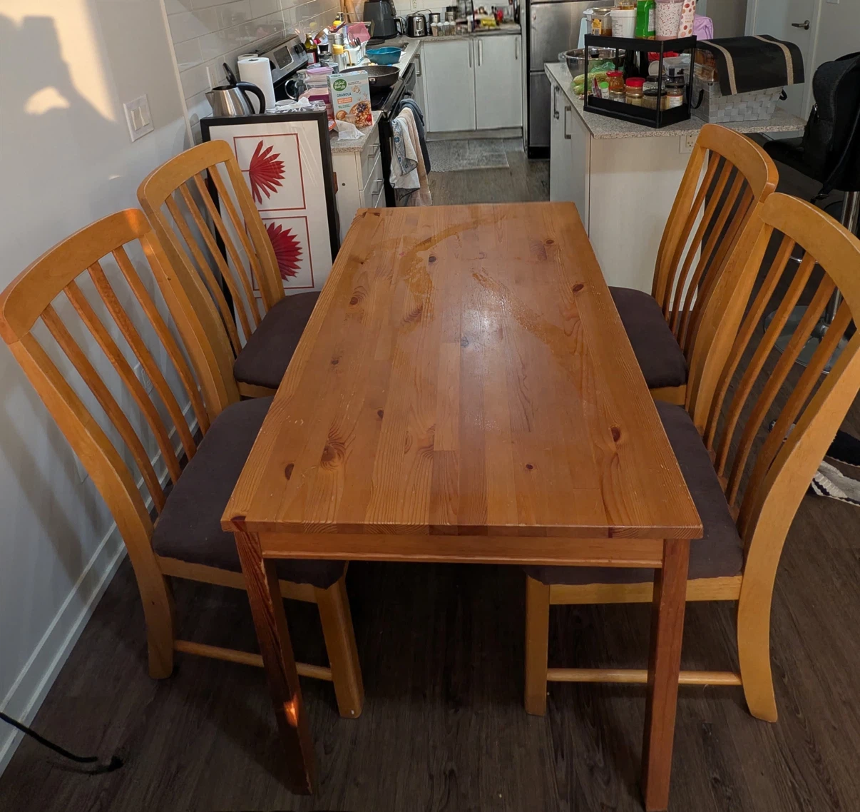 Wooden dining table with four chairs
