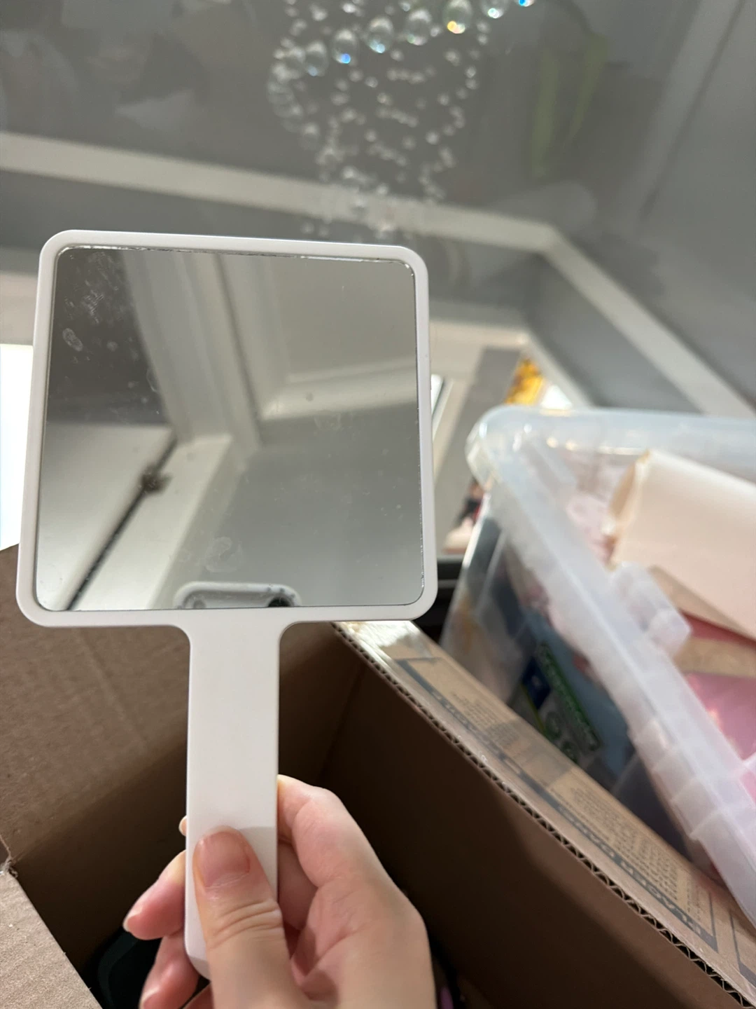 White handheld mirror