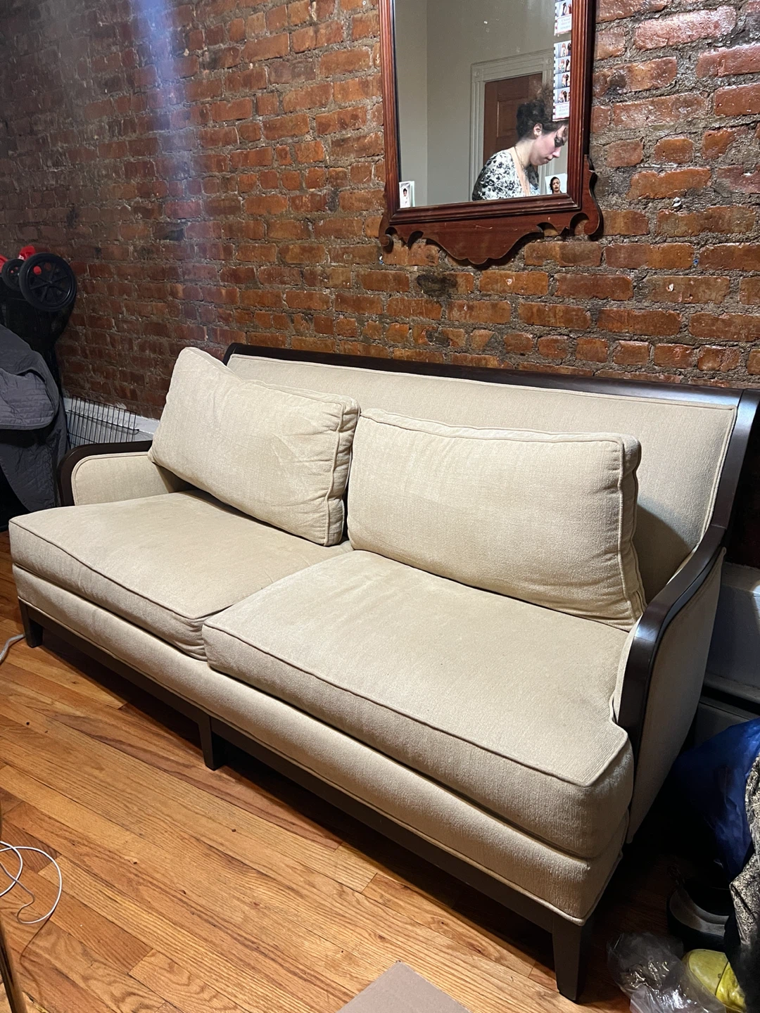 Beige Two-Seater Sofa with Dark Wood Frame