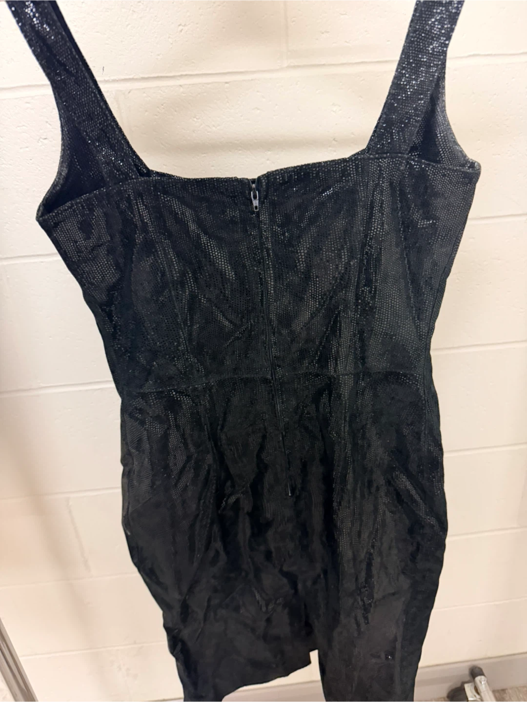 Black sleeveless textured mini dress
