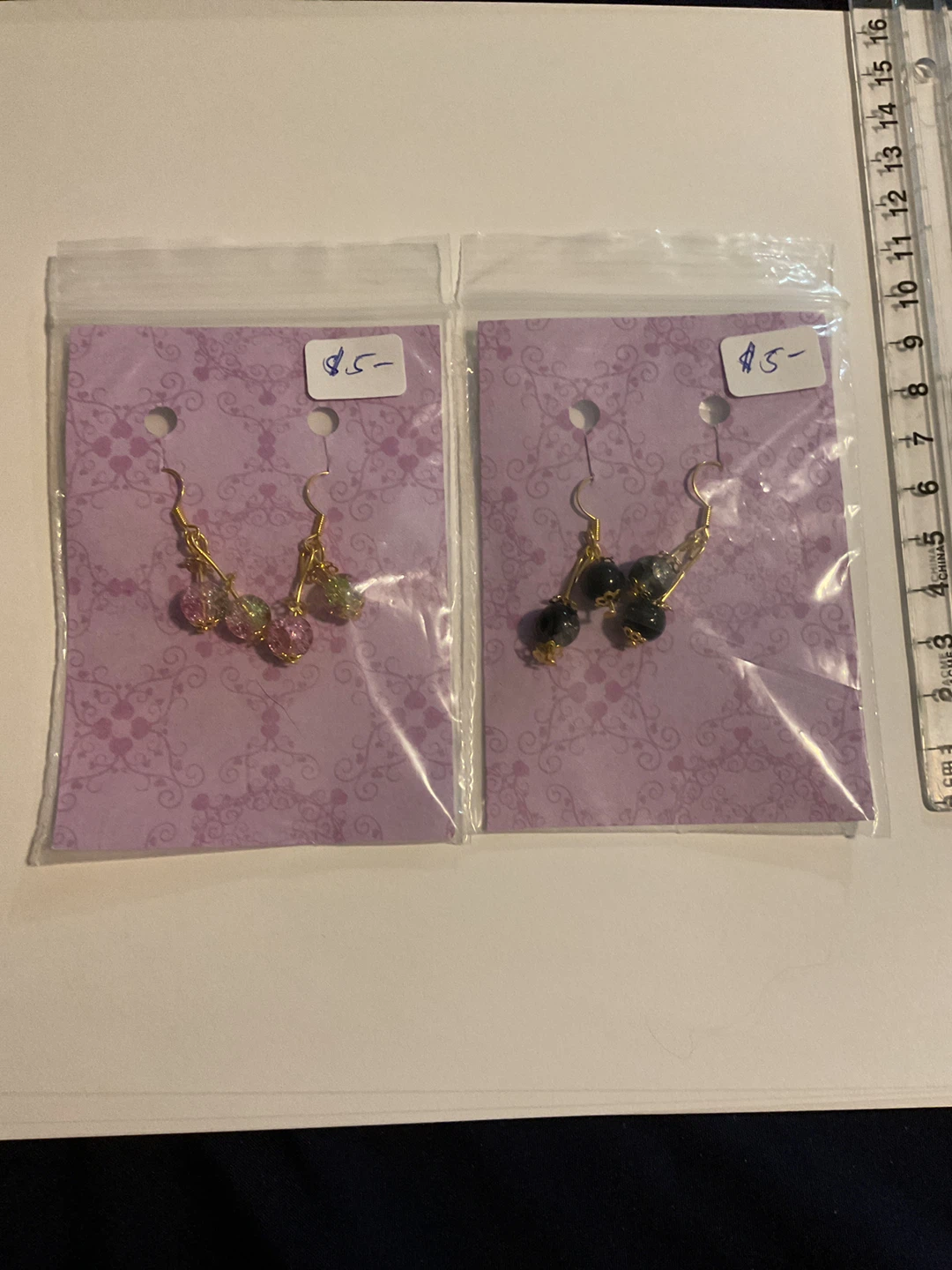 Two pairs of handmade beaded earrings