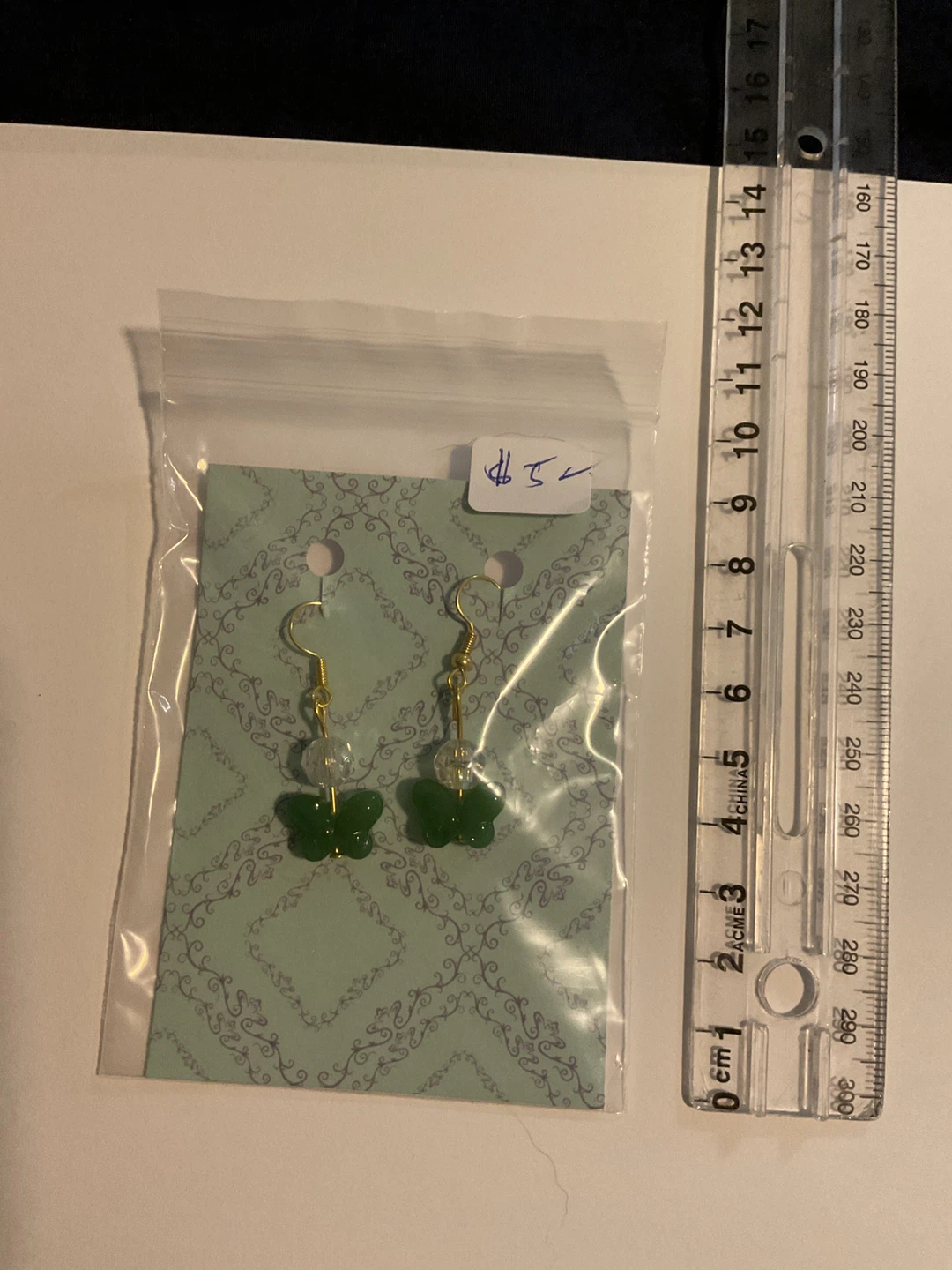 Green butterfly dangle earrings