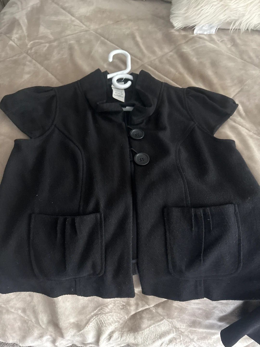 Black vest with buttons