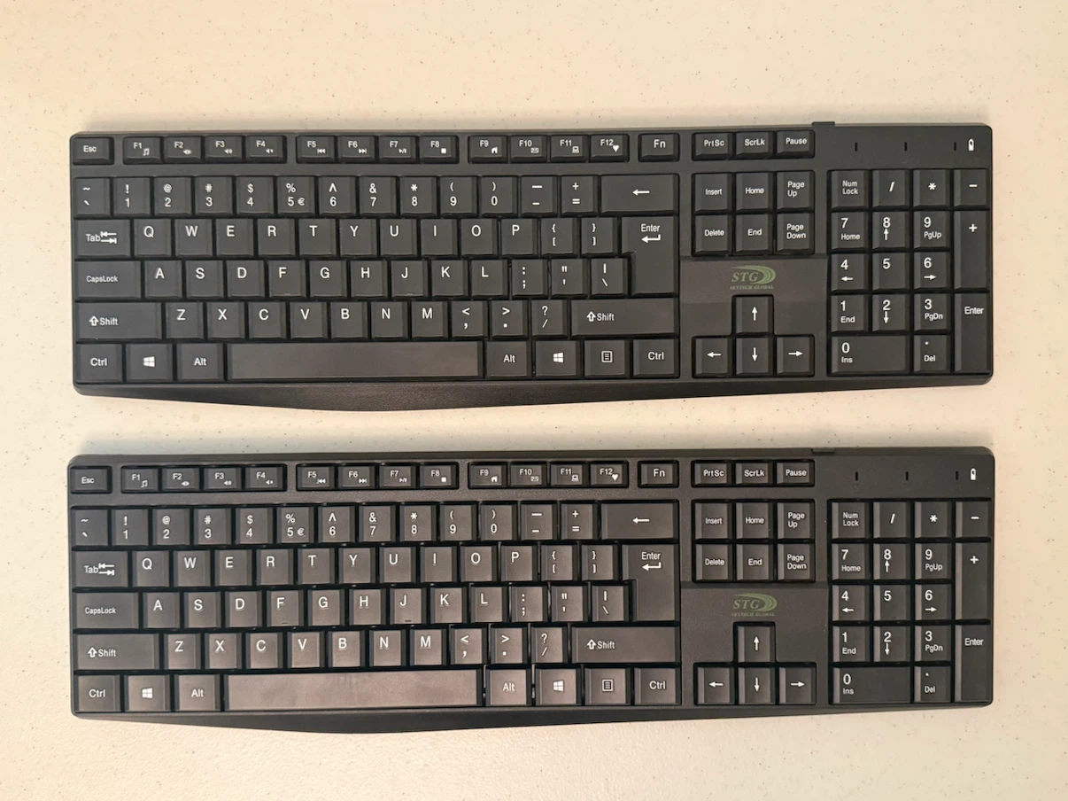 Two STG Global Black Keyboards