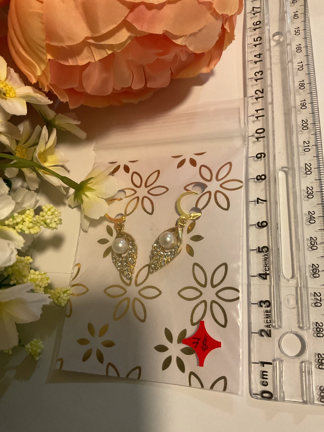 Gold-tone leaf earrings with pearl and crystal