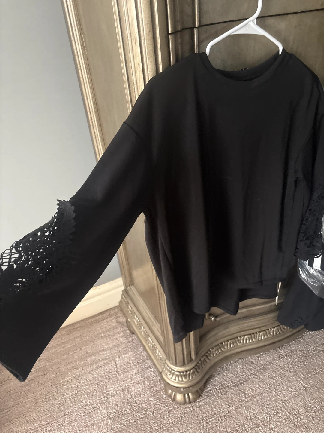 Black long-sleeve top with lace detail