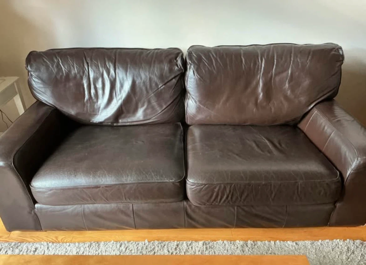 Dark brown leather loveseat