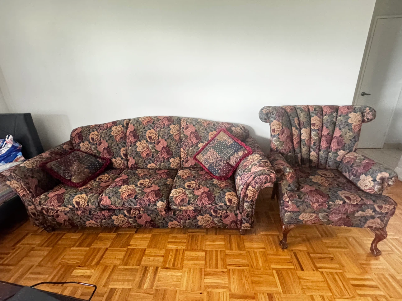 Floral pattern sofa and matching armchair