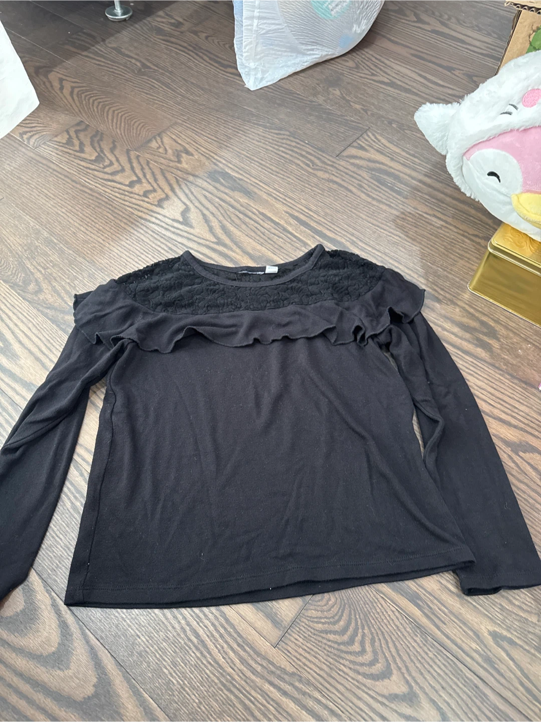 Black long-sleeved shirt with lace detail