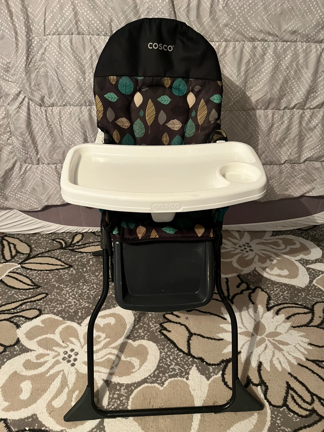 Cosco high chair with leaf pattern