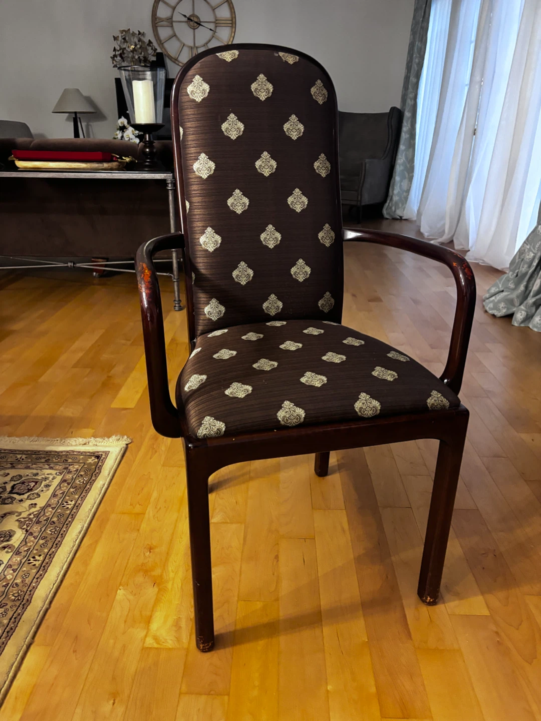 Eight vintage dark wood armchairs with patterned fabric