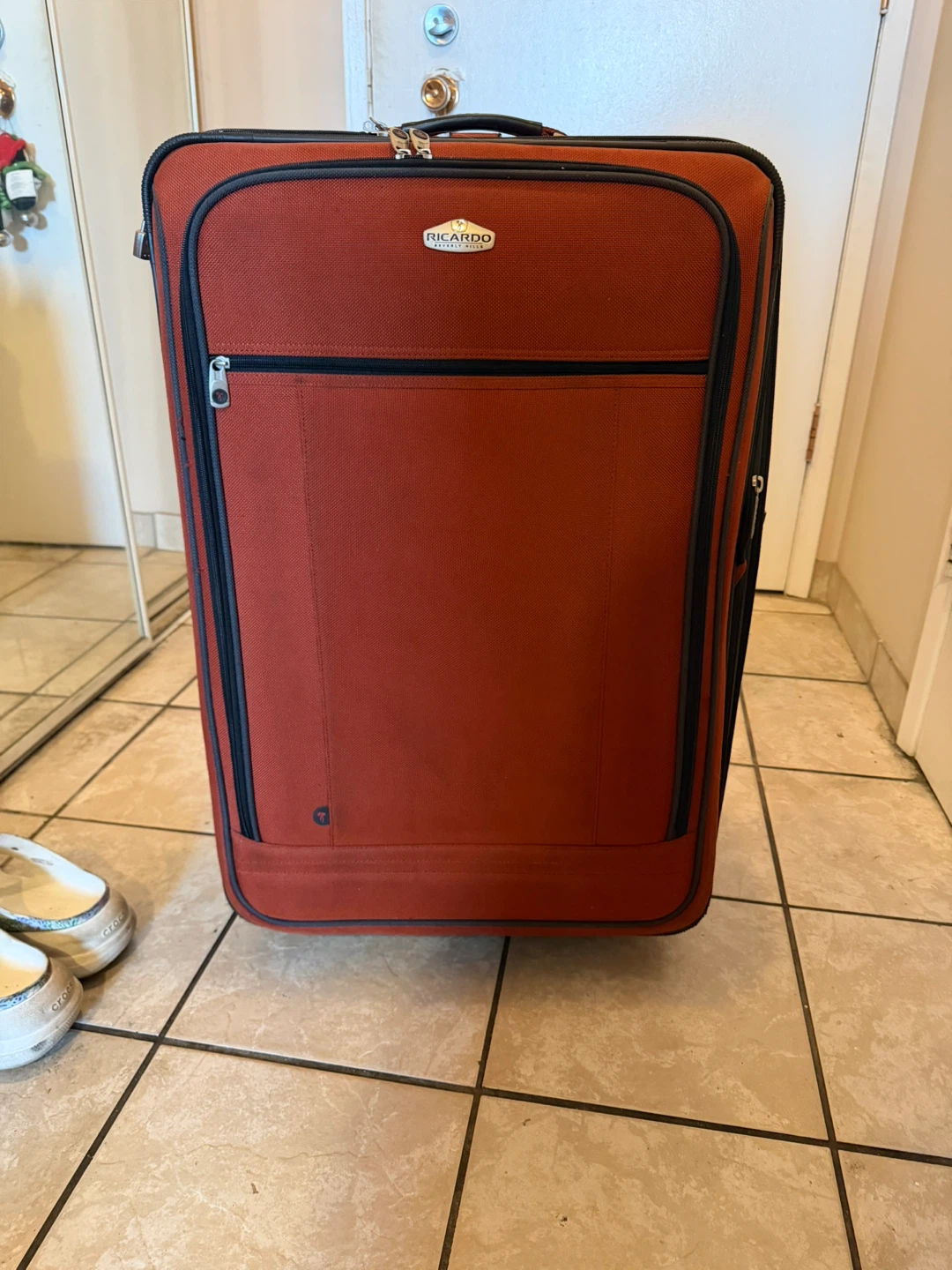 Large orange suitcase