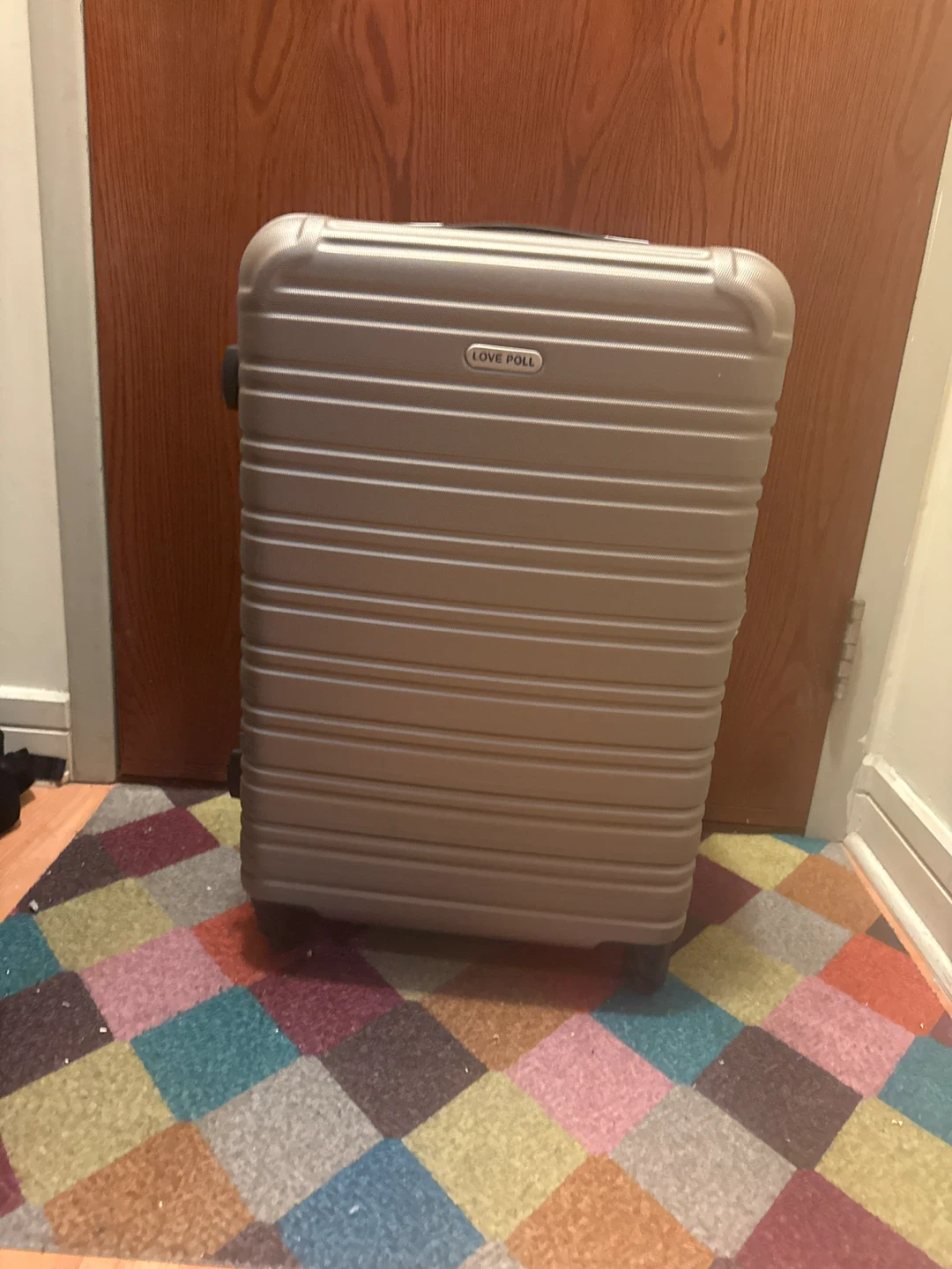 Love Poll hard-shell carry-on suitcase