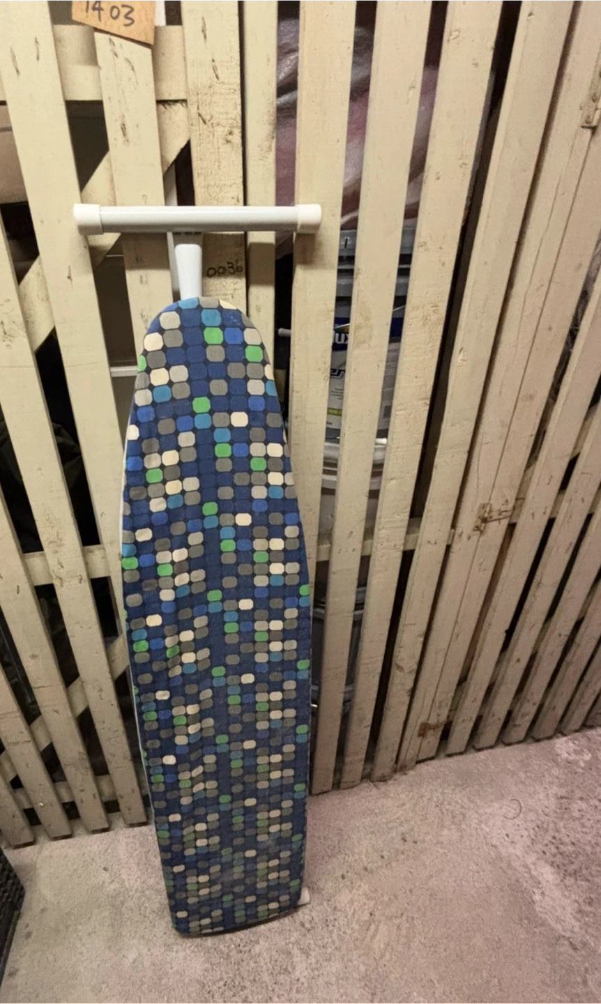 Ironing board with blue geometric pattern cover