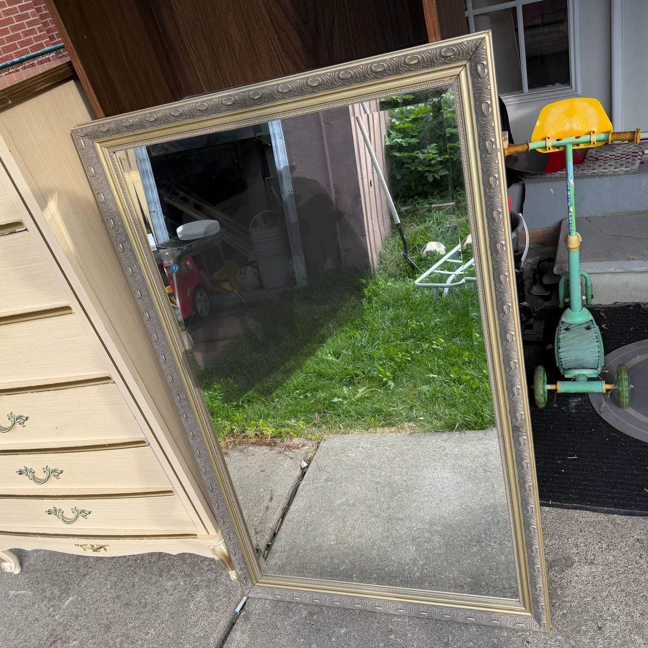 Large ornate gold-toned wall mirror