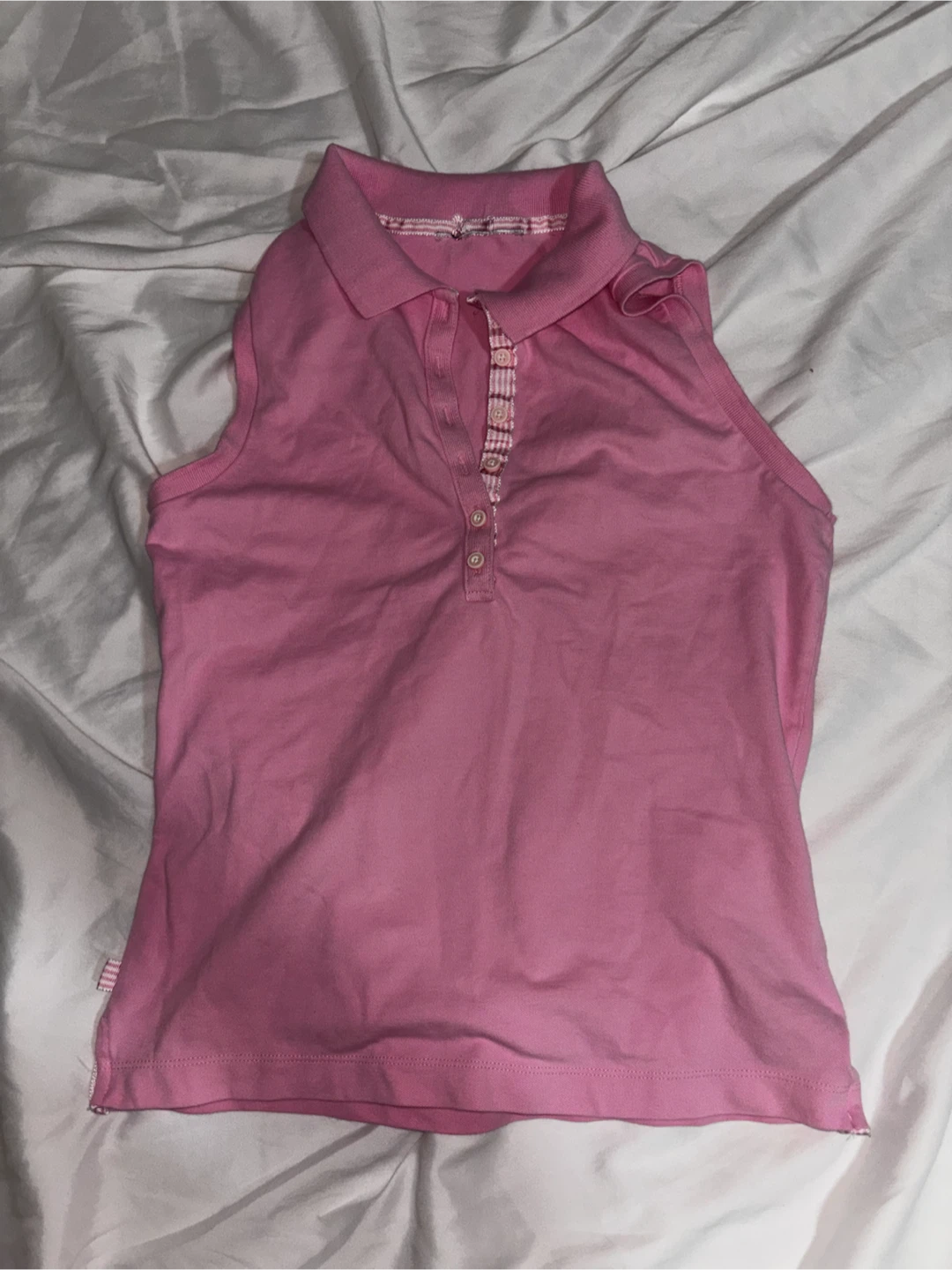Pink sleeveless polo shirt
