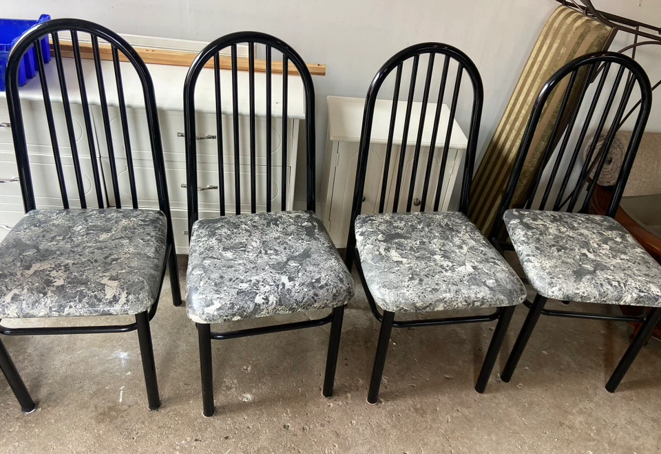 Set of four black metal dining chairs