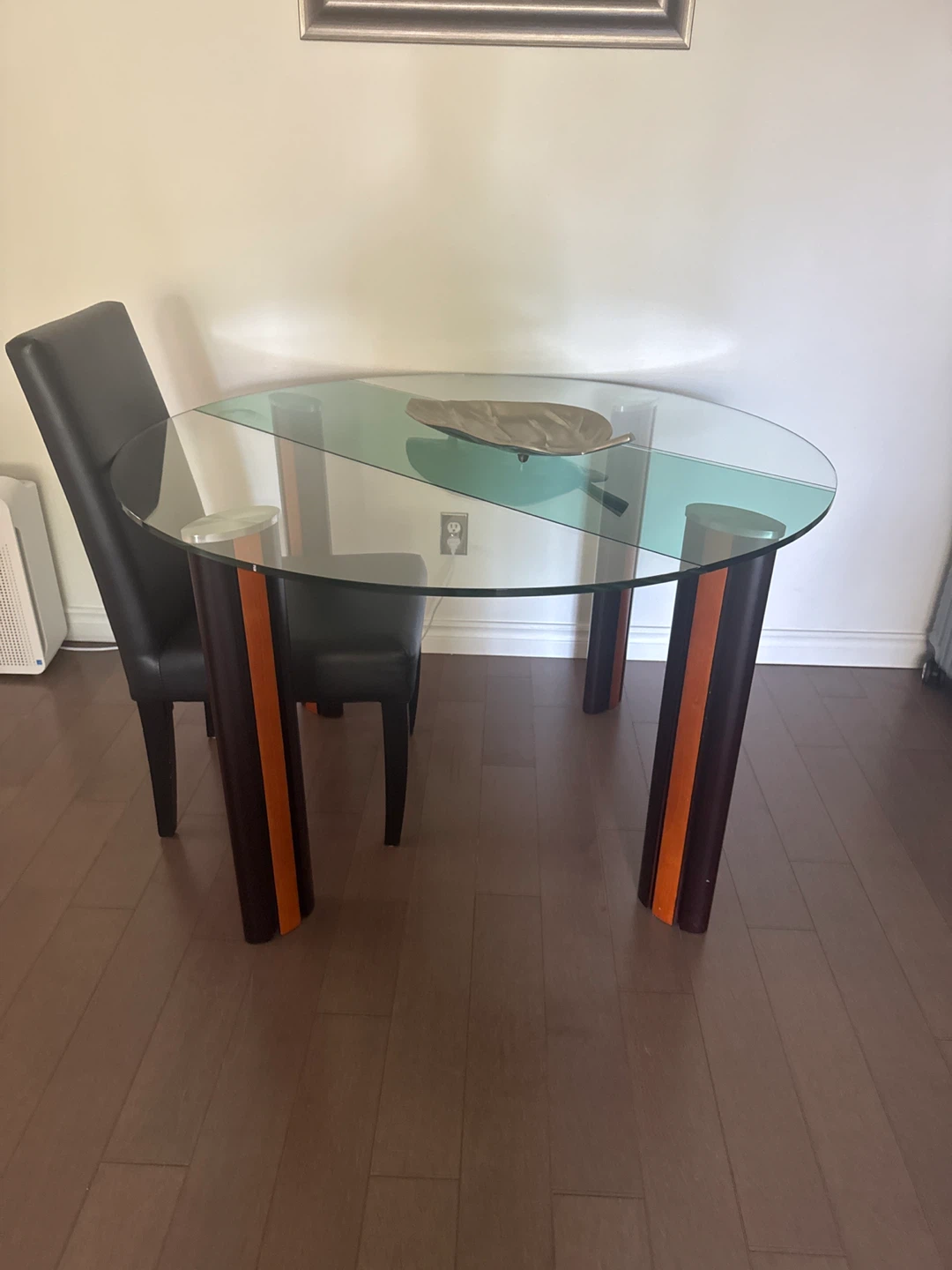 Round glass top dining table with wood legs