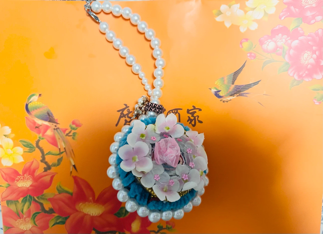 Decorative floral faux-pearl charm